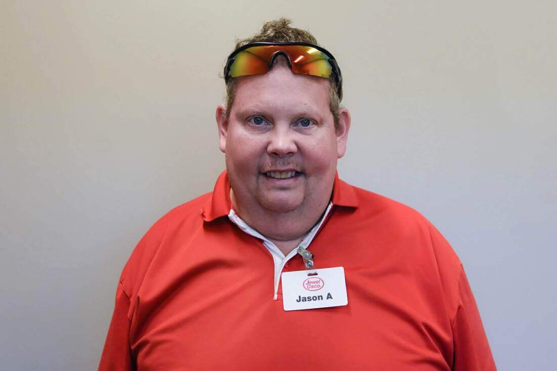 Opportunity House client smiling at the camera during supported employment.