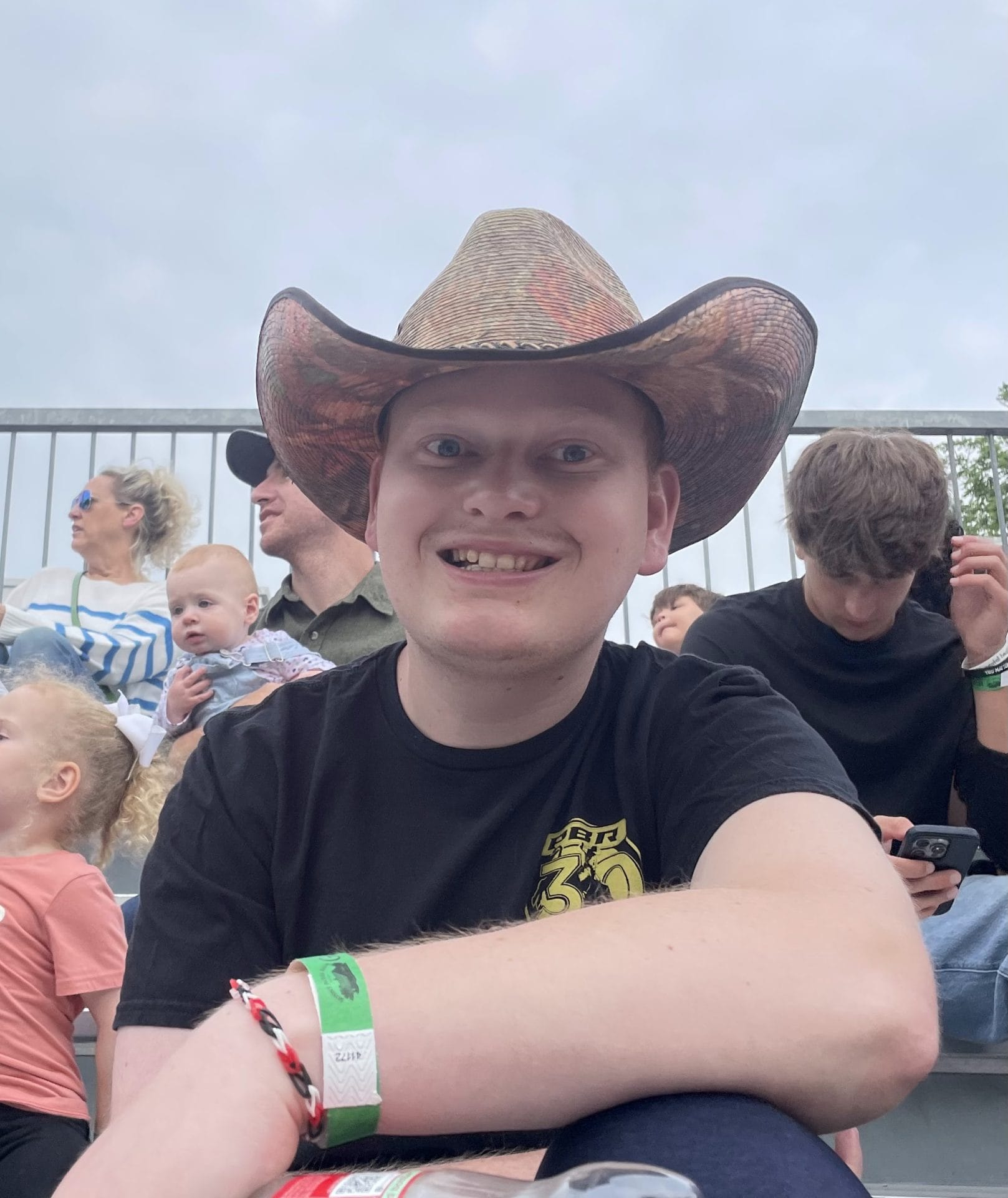 Opportunity House client wearing cowboy hat smiling for photo.
