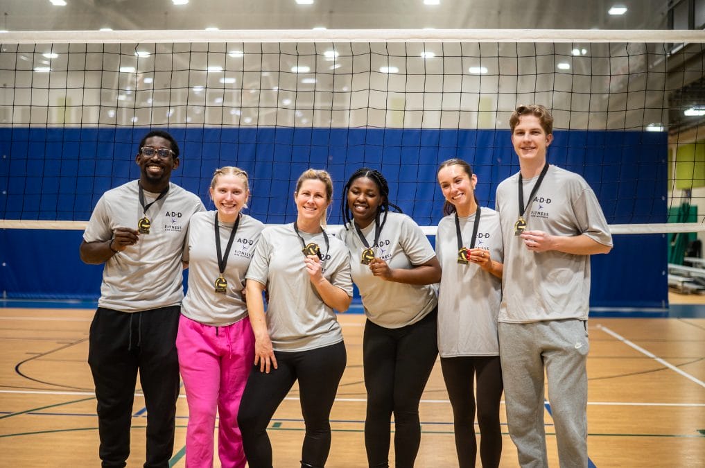 Pool A Volleyball Team Winners posing with medals.