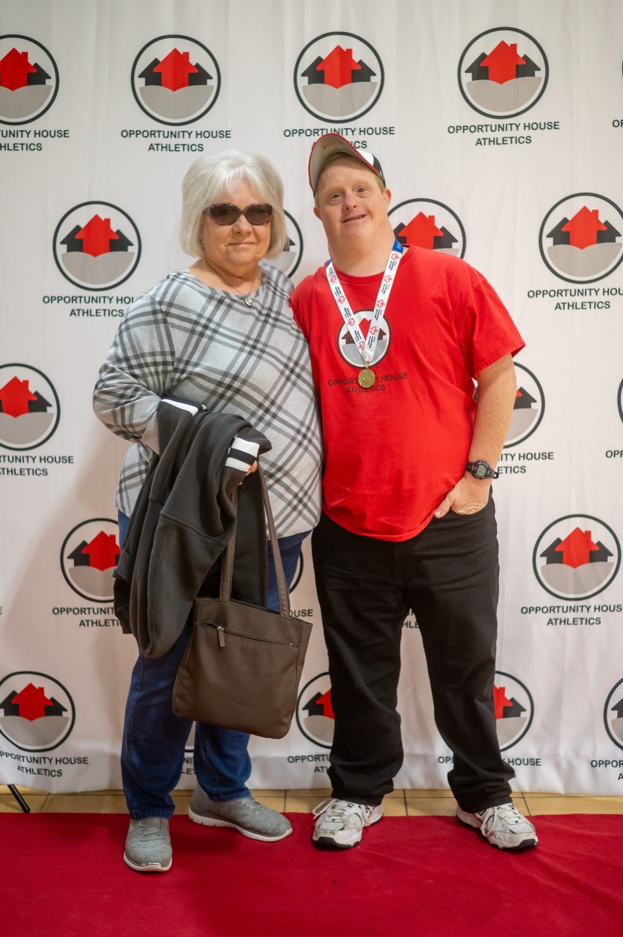 Opportunity House Athletics athlete posing with mother