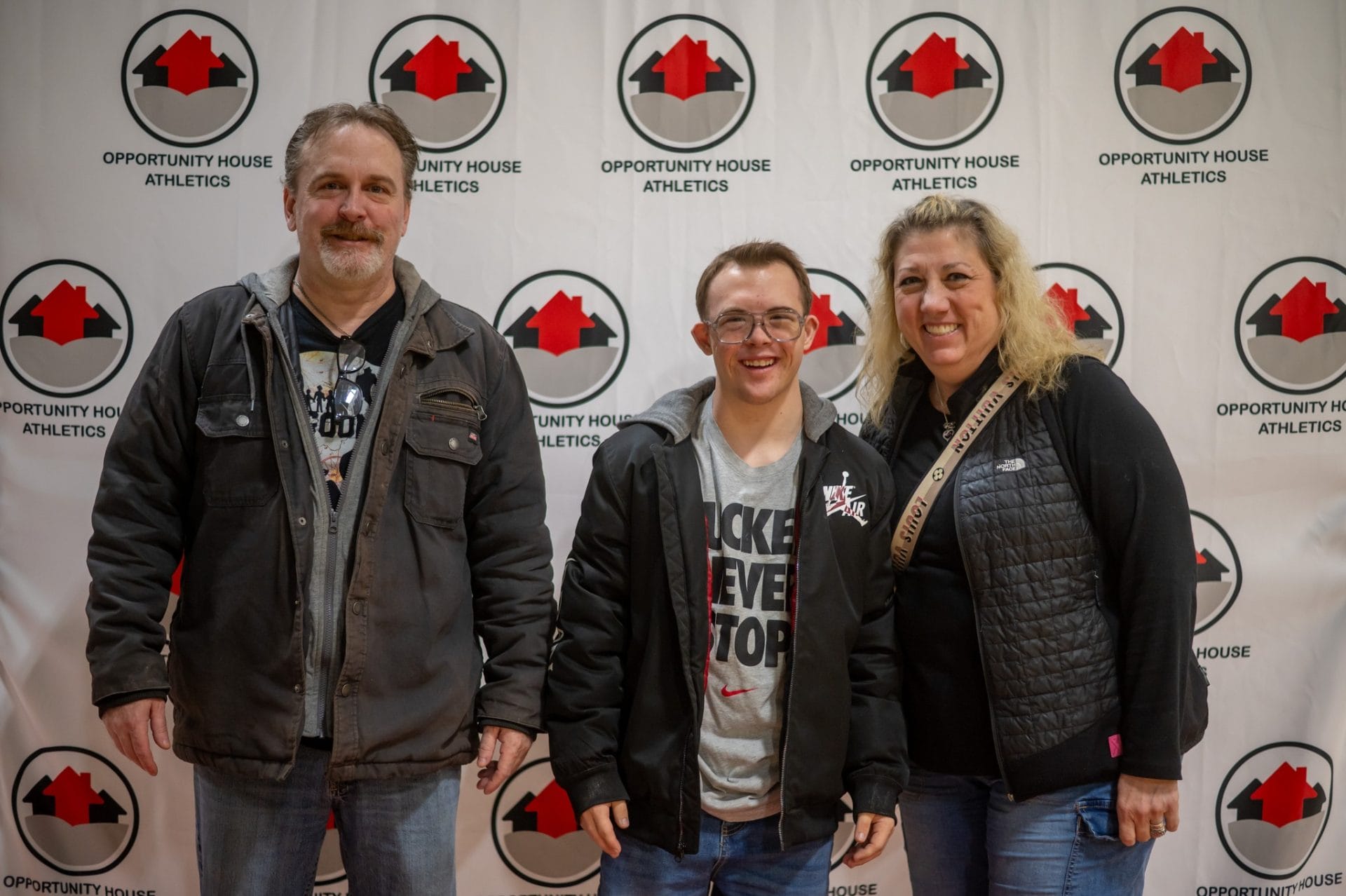 Opportunity House Athletics athlete with parents