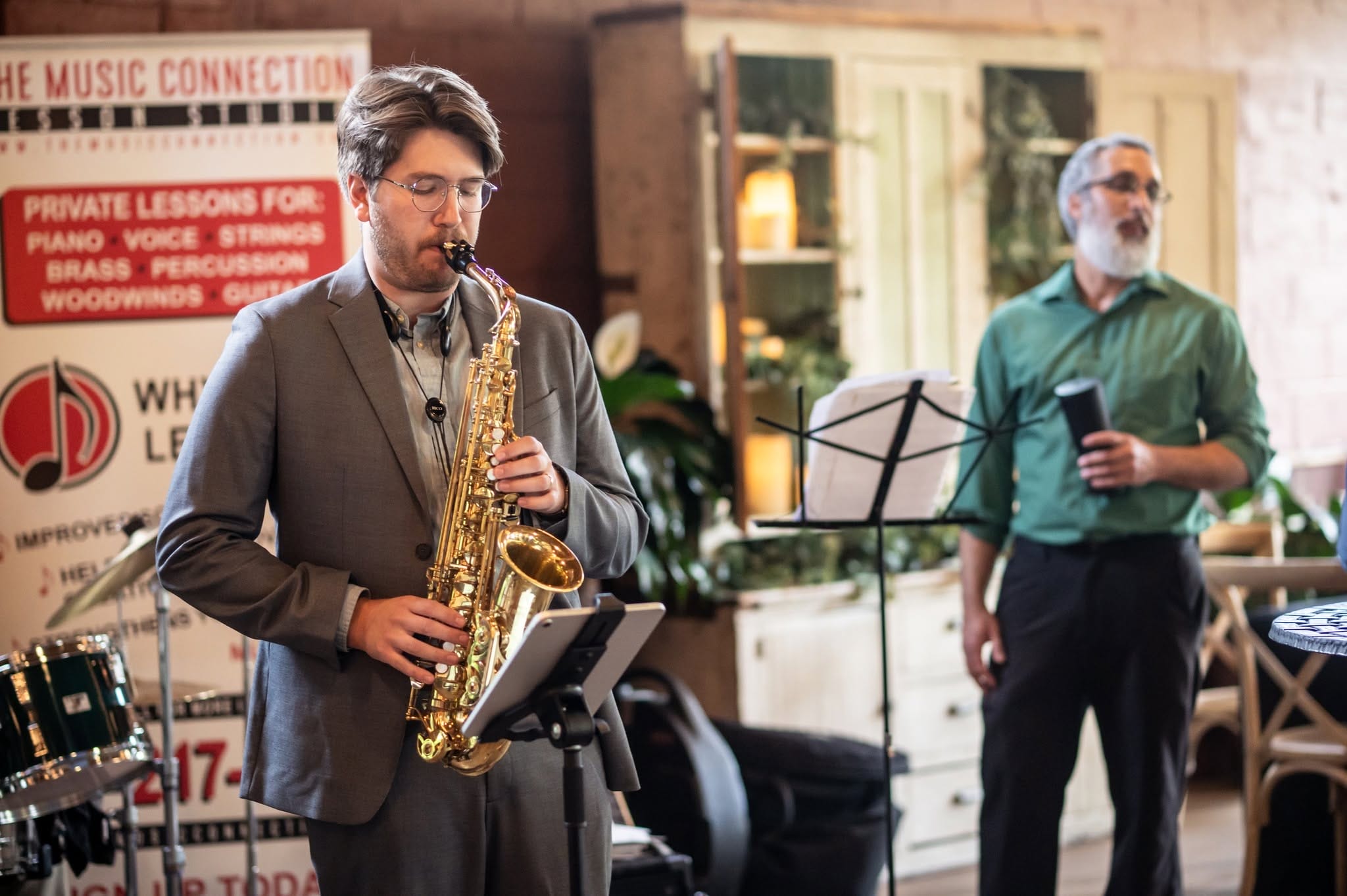 Band member playing the saxophone.