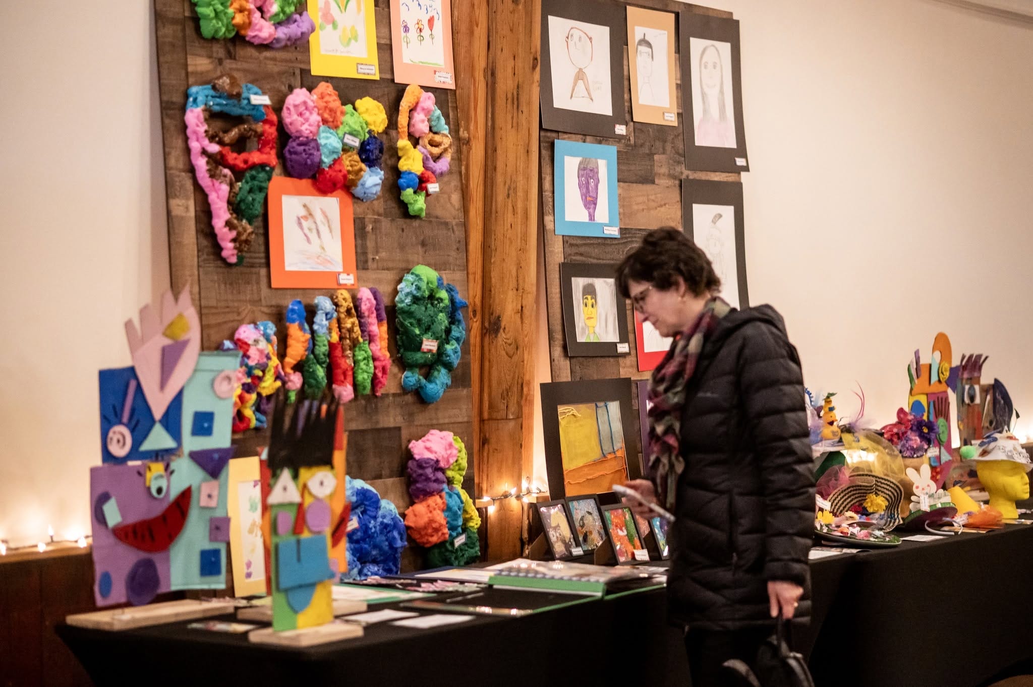 OH Client mother looking at art showcase.